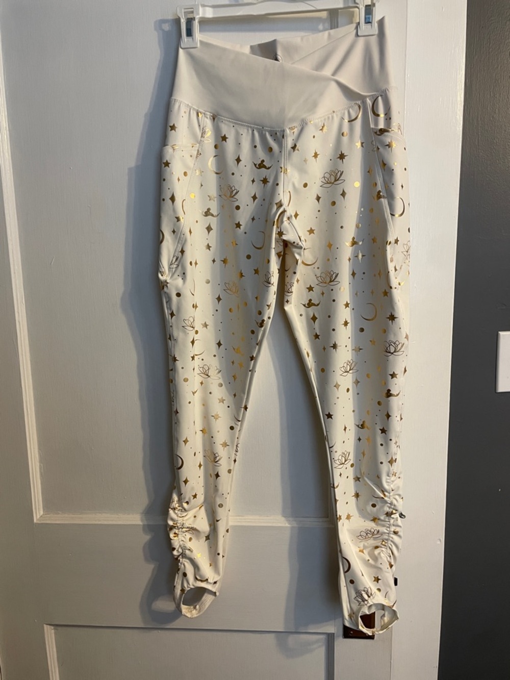 NWOT Disney Cream Leggings with Subtle Logo Print